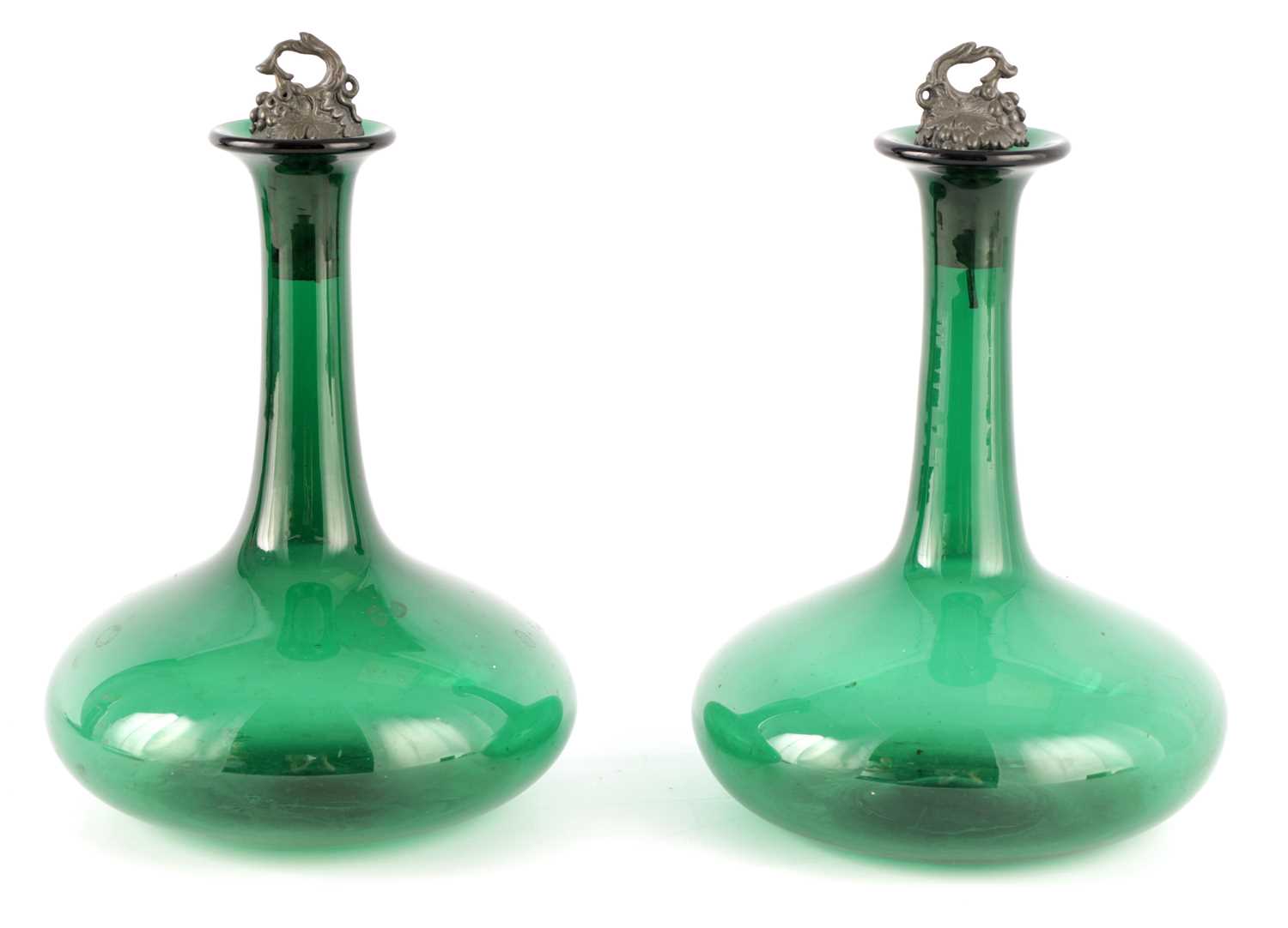 Lot 11 - A PAIR OF LATE GEORGIAN BRISTOL GREEN DECANTERS