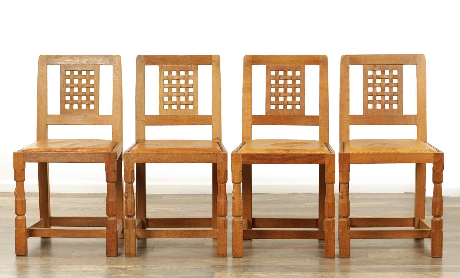 Lot 1259 - A SET OF FOUR ROBERT ‘MOUSEMAN’ THOMPSON AZED OAK LATTICE BACK DINING CHAIRS