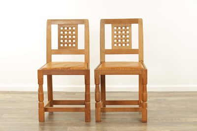 Lot 1259 - A SET OF FOUR ROBERT ‘MOUSEMAN’ THOMPSON AZED OAK LATTICE BACK DINING CHAIRS