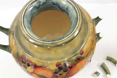 Lot 42 - AN EARLY WILLIAM MOORCROFT LARGE TWO-HANDLED FOOTED BULBOUS VASE