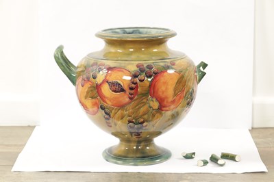Lot 42 - AN EARLY WILLIAM MOORCROFT LARGE TWO-HANDLED FOOTED BULBOUS VASE