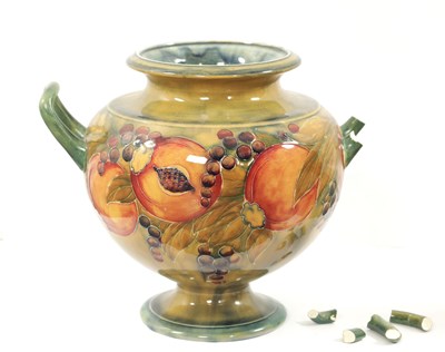 Lot 42 - AN EARLY WILLIAM MOORCROFT LARGE TWO-HANDLED FOOTED BULBOUS VASE