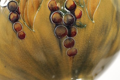 Lot 42 - AN EARLY WILLIAM MOORCROFT LARGE TWO-HANDLED FOOTED BULBOUS VASE