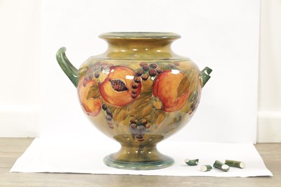 Lot 42 - AN EARLY WILLIAM MOORCROFT LARGE TWO-HANDLED FOOTED BULBOUS VASE
