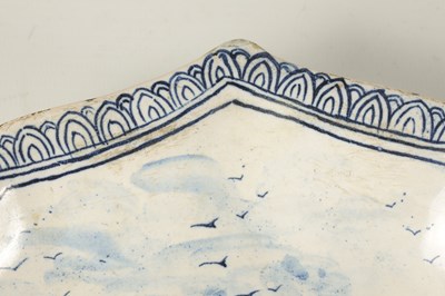 Lot 80 - AN 18TH/19TH CENTURY DELFT BLUE AND WHITE SHAPED SHALLOW DISH