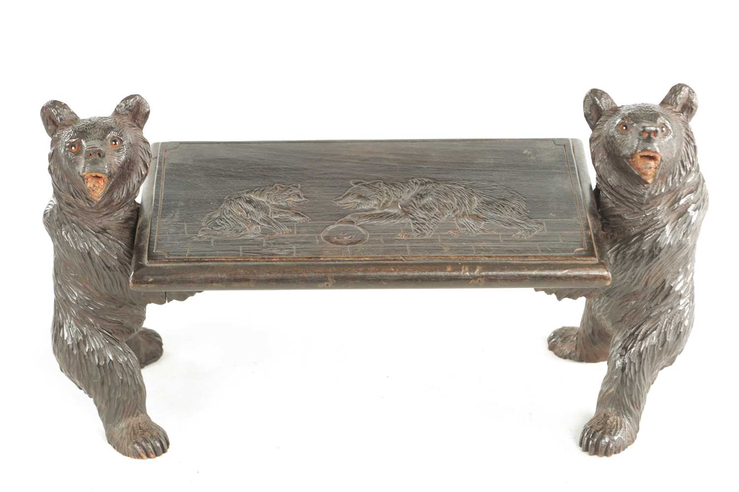 Lot 898 - A 19TH CENTURY CARVED LINDEN WOOD BLACK FOREST CHILDS STOOL