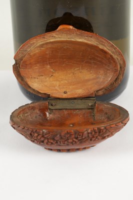 Lot 755 - A 19TH CENTURY CARVED COQUILLA NUT SNUFF BOX