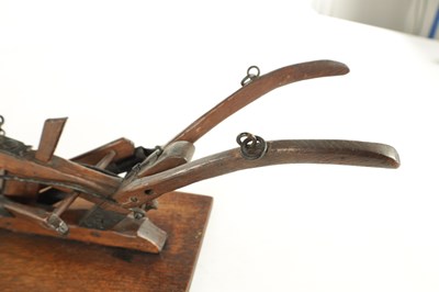 Lot 955 - A GOOD 19TH CENTURY OAK AND STEEL MODEL OF A HAND HELD PLOUGH