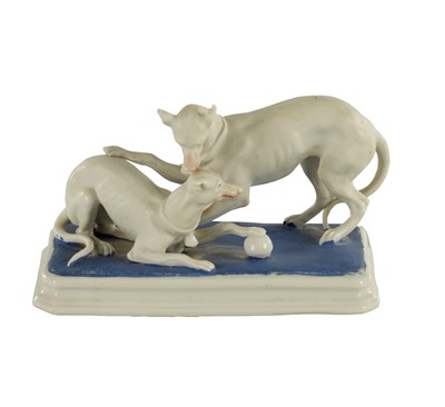 Lot 71 - A LATE 19TH CENTURY GERMAN BISQUE PORCELAIN SCULPTURE OF TWO WHIPPETS PLAYING