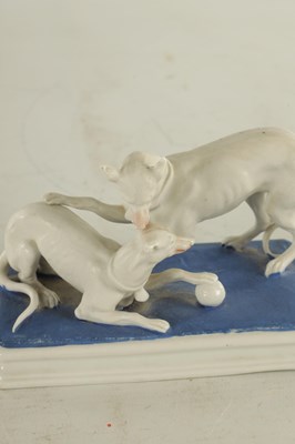 Lot 71 - A LATE 19TH CENTURY GERMAN BISQUE PORCELAIN SCULPTURE OF TWO WHIPPETS PLAYING