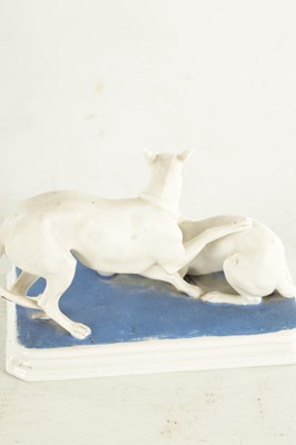 Lot 71 - A LATE 19TH CENTURY GERMAN BISQUE PORCELAIN SCULPTURE OF TWO WHIPPETS PLAYING
