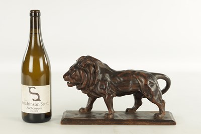Lot 884 - A LATE 19TH CENTURY CONTINENTAL CARVED WOOD SCULPTURE OF A PROWLING LION
