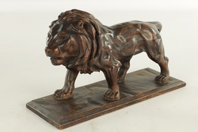 Lot 884 - A LATE 19TH CENTURY CONTINENTAL CARVED WOOD SCULPTURE OF A PROWLING LION