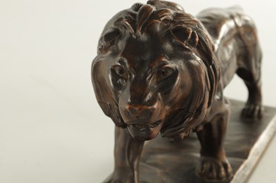 Lot 884 - A LATE 19TH CENTURY CONTINENTAL CARVED WOOD SCULPTURE OF A PROWLING LION