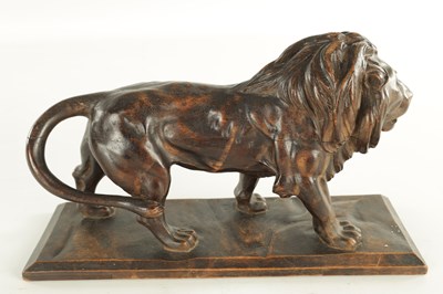 Lot 884 - A LATE 19TH CENTURY CONTINENTAL CARVED WOOD SCULPTURE OF A PROWLING LION