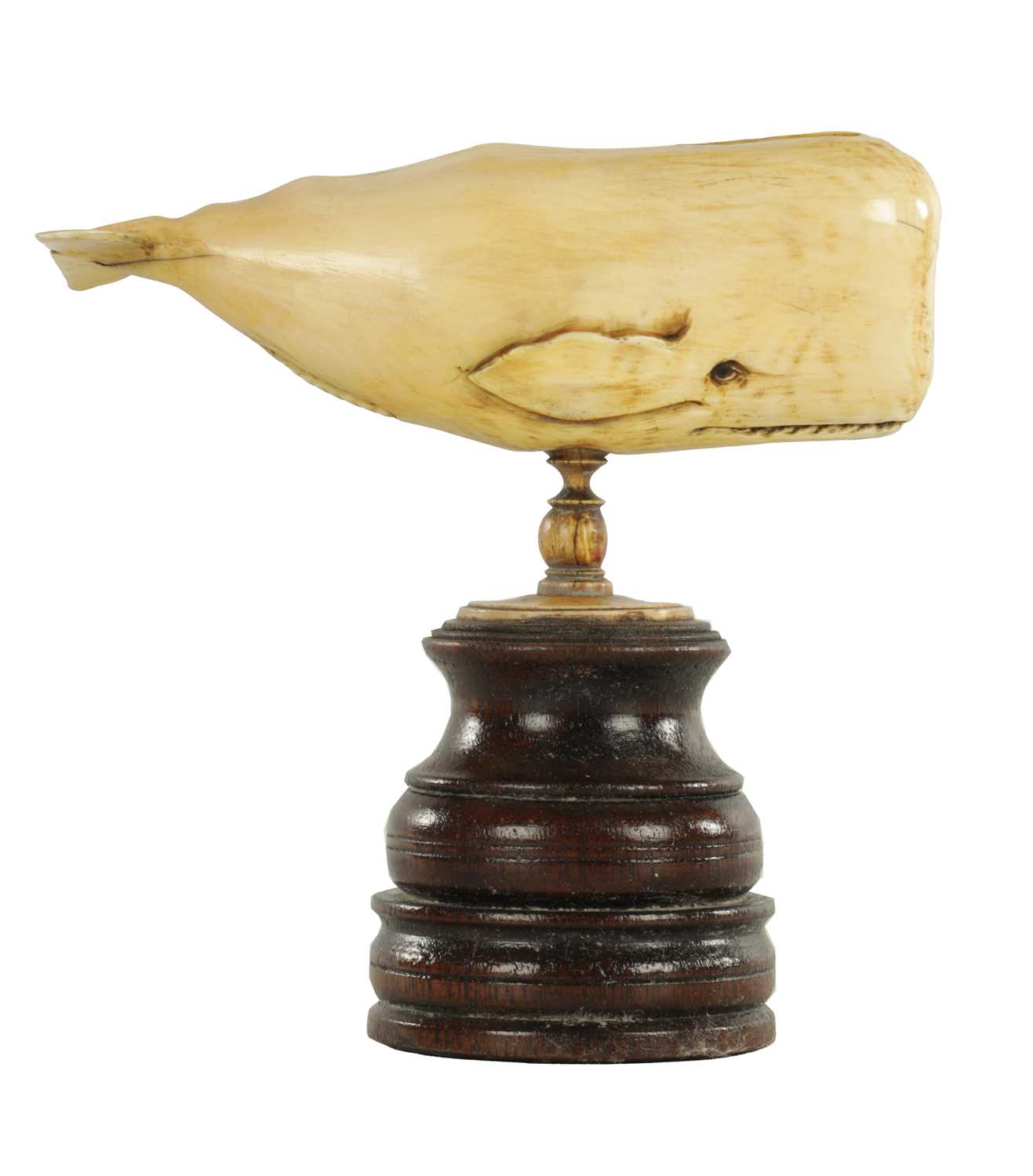 Lot 759 - A 19TH CENTURY SCRIMSHAW-CARVED MARINE IVORY SCULPTURE MODELLED AS A SPERM WHALE