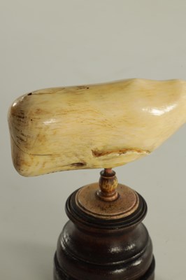Lot 759 - A 19TH CENTURY SCRIMSHAW-CARVED MARINE IVORY SCULPTURE MODELLED AS A SPERM WHALE