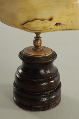 Lot 759 - A 19TH CENTURY SCRIMSHAW-CARVED MARINE IVORY SCULPTURE MODELLED AS A SPERM WHALE