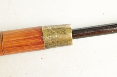 Lot 515 - AN EARLY 20TH CENTURY JAPANESE CARVED BAMBOO CARVED STICK WITH FITTED TELESCOPIC FISHING ROD