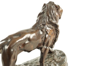 Lot 785 - A 19TH CENTURY BROWN PATINATED STANDING BRONZE LION