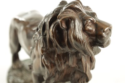 Lot 785 - A 19TH CENTURY BROWN PATINATED STANDING BRONZE LION