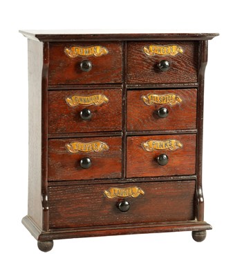 Lot 920 - A 19TH CENTURY OAK SPICE CABINET