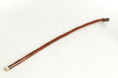 Lot 509 - AN EARLY 19TH CENTURY FOLK ART CARVED WALKING STICK