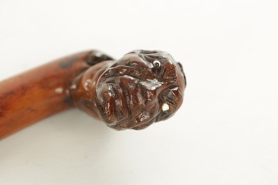 Lot 509 - AN EARLY 19TH CENTURY FOLK ART CARVED WALKING STICK