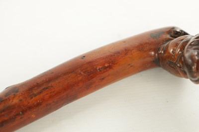 Lot 509 - AN EARLY 19TH CENTURY FOLK ART CARVED WALKING STICK