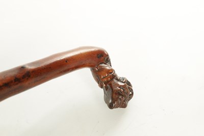 Lot 509 - AN EARLY 19TH CENTURY FOLK ART CARVED WALKING STICK