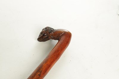 Lot 509 - AN EARLY 19TH CENTURY FOLK ART CARVED WALKING STICK