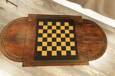 Lot 1215 - A FINE REGENCY FIGURED ROSEWOOD AND BRASS INLAID GAMES TABLE IN THE MANNER OF GILLOWS