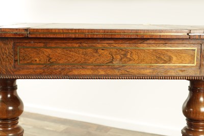 Lot 1215 - A FINE REGENCY FIGURED ROSEWOOD AND BRASS INLAID GAMES TABLE IN THE MANNER OF GILLOWS