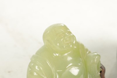 Lot 146 - A CHINESE CARVED JADE SCULPTURE OF A SEATED BUDDHA