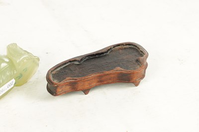 Lot 146 - A CHINESE CARVED JADE SCULPTURE OF A SEATED BUDDHA