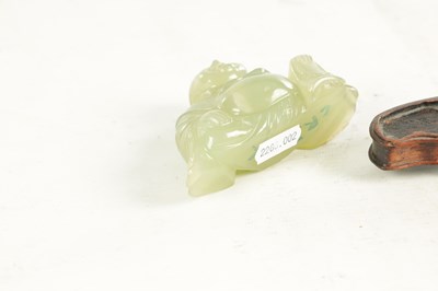Lot 146 - A CHINESE CARVED JADE SCULPTURE OF A SEATED BUDDHA