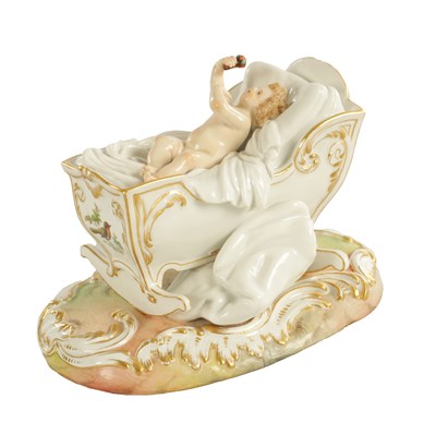 Lot 106 - A 19TH CENTURY MEISSEN CRADLE AND CHERUB FIGURE