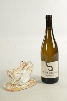 Lot 106 - A 19TH CENTURY MEISSEN CRADLE AND CHERUB FIGURE
