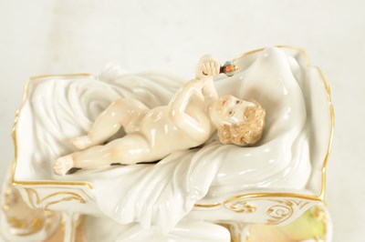Lot 106 - A 19TH CENTURY MEISSEN CRADLE AND CHERUB FIGURE