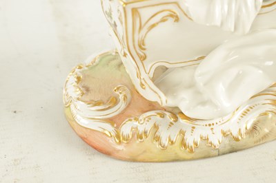 Lot 106 - A 19TH CENTURY MEISSEN CRADLE AND CHERUB FIGURE