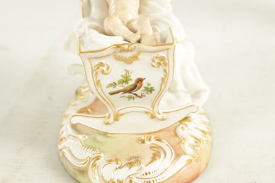 Lot 106 - A 19TH CENTURY MEISSEN CRADLE AND CHERUB FIGURE
