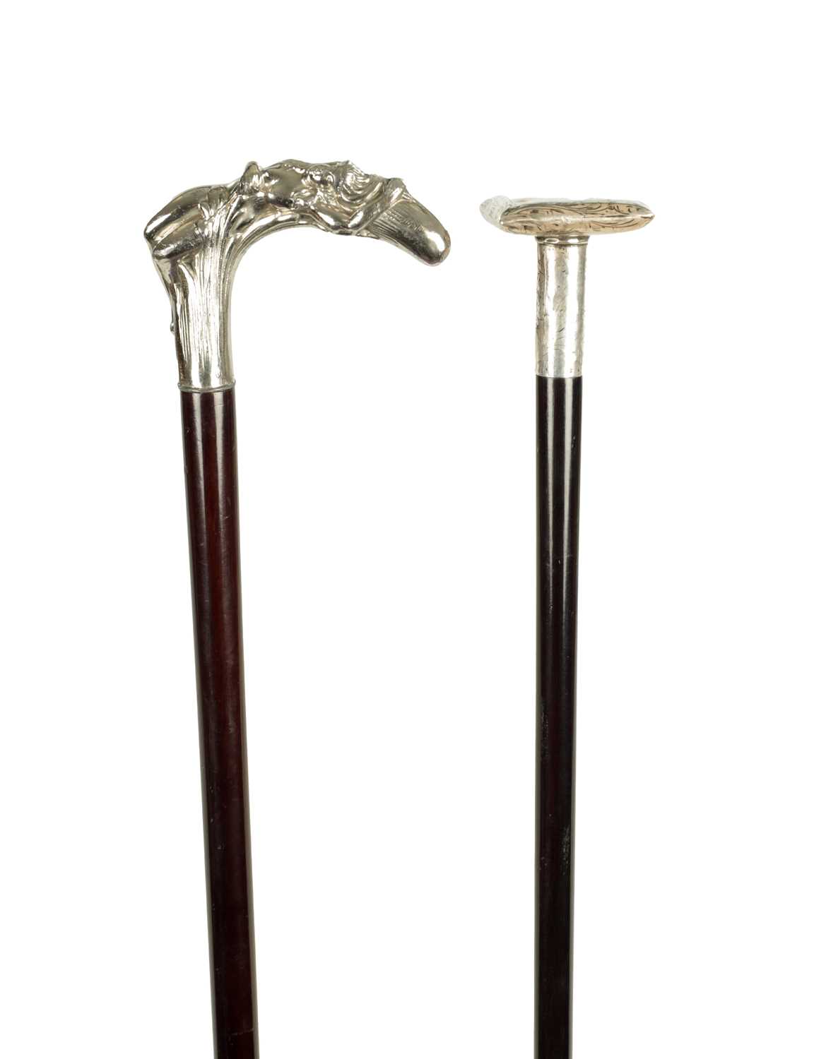 Lot 505 - A LATE 19TH CENTURY SILVER CUSHION TOPPED WALKING STICK TOGETHER WITH A SILVER PLATED ART NOVEAU STYLE STICK WITH A NUDE FEMALE LAYING IN BULL RUSHES