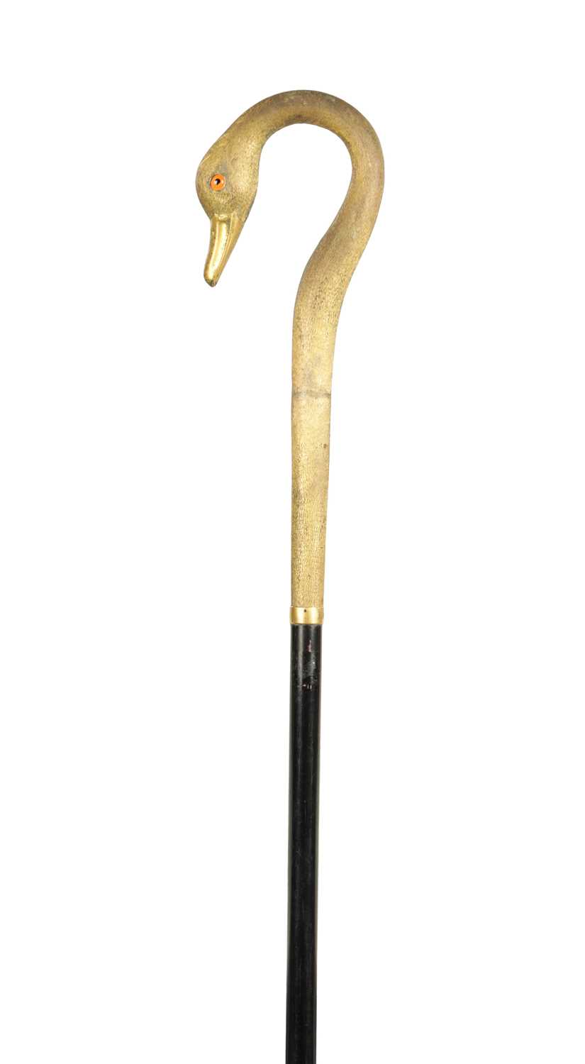 494 - A LATE 19TH CENTURY GILT METAL SWAN'S HEAD WALKING STICK