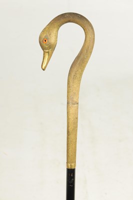 Lot 494 - A LATE 19TH CENTURY GILT METAL SWAN'S HEAD WALKING STICK