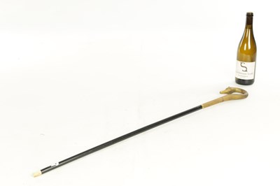 Lot 494 - A LATE 19TH CENTURY GILT METAL SWAN'S HEAD WALKING STICK