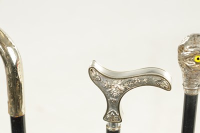 Lot 498 - A COLLECTION OF THREE FRENCH SILVER AND SILVER PLATE LADIES WALKING STICKS