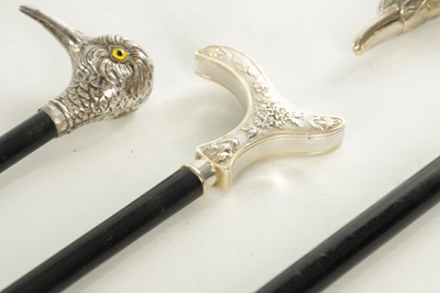 Lot 498 - A COLLECTION OF THREE FRENCH SILVER AND SILVER PLATE LADIES WALKING STICKS