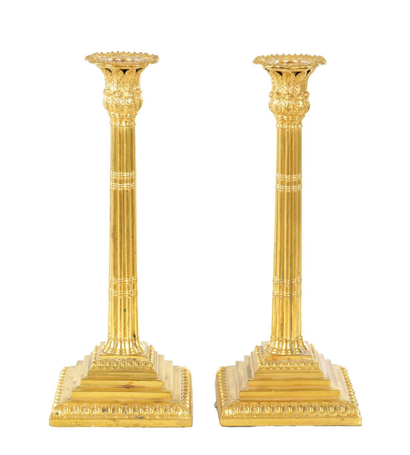 407 - A PAIR OF EARLY 19TH CENTURY CONTINENTAL SILVER GILT TABLE CANDLESTICKS