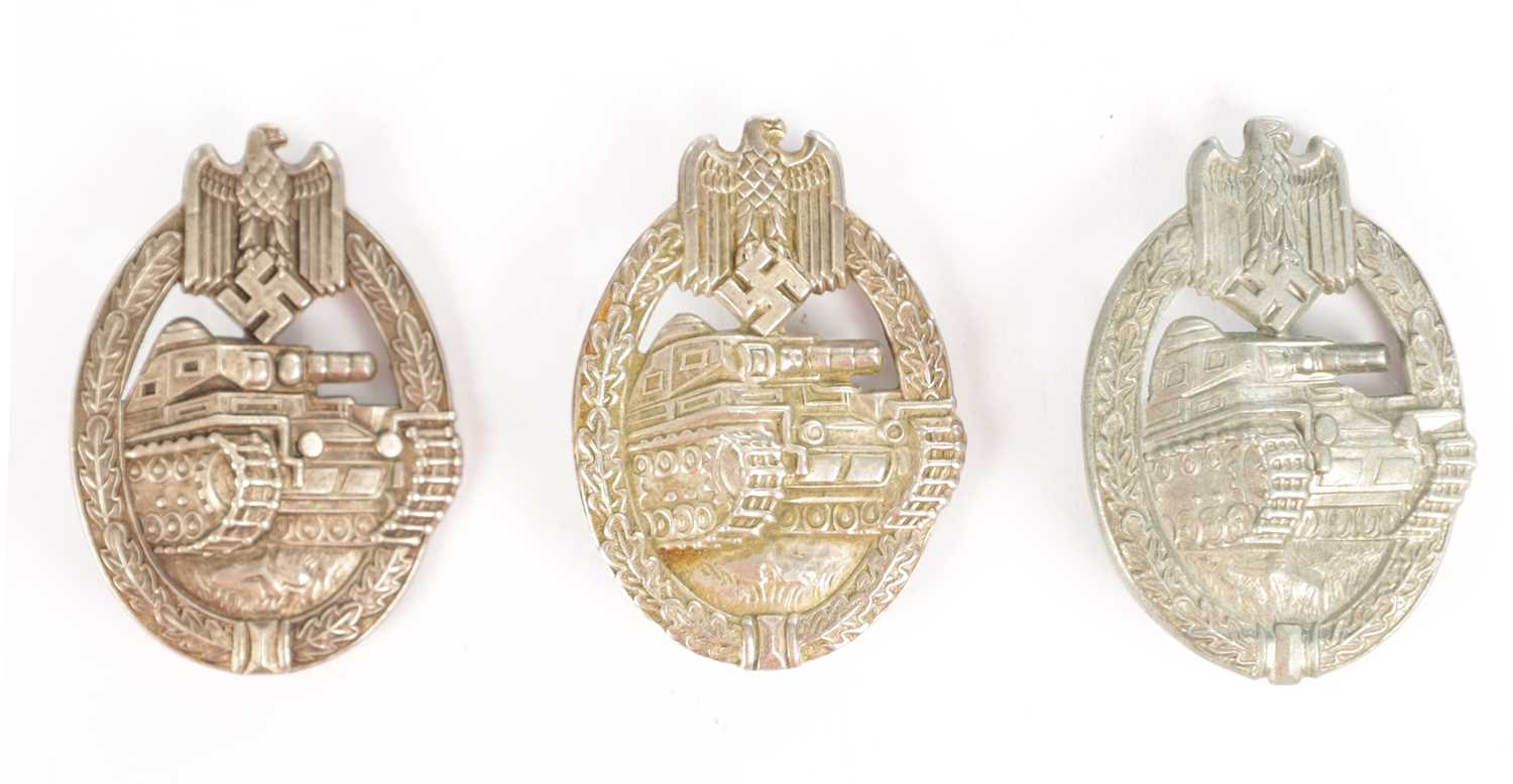 Lot 548 - A COLLECTION OF THREE WW2 GERMAN THIRD REICH SILVER AND SILVER METAL PANZER ASSAULT BADGES