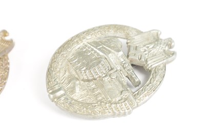 Lot 548 - A COLLECTION OF THREE WW2 GERMAN THIRD REICH SILVER AND SILVER METAL PANZER ASSAULT BADGES